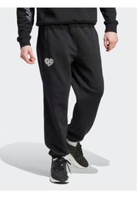 Adidas - adidas Spodnie dresowe HY1288 Czarny Loose Fit. Kolor: czarny. Materiał: dresówka, bawełna