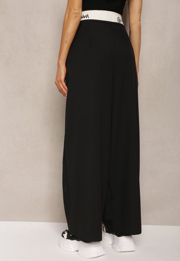 Renee - Czarne Spodnie Palazzo High Waist z Szerokimi Nogawkami z Zapięciem na Guziki i Zamek Lomedia. Okazja: na spotkanie biznesowe. Stan: podwyższony. Kolekcja: plus size. Kolor: czarny. Wzór: aplikacja. Styl: sportowy, elegancki, biznesowy, klasyczny