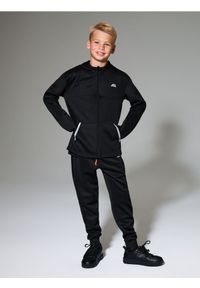 Sinsay - Spodnie sportowe z odblaskowymi elementami - czarny. Kolor: czarny. Styl: sportowy