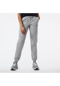 Spodnie damskie New Balance WP23811AG – szare. Kolor: szary. Materiał: bawełna, dresówka, poliester. Sport: fitness