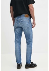 Calvin Klein - CALVIN KLEIN Błękitne męskie jeansy Slim Taper. Kolor: niebieski. Styl: elegancki #5