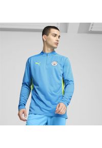 Puma - Męska bluza treningowa Manchester City z zamkiem 1/4 PUMA Magic Blue Yellow Glow. Kolor: niebieski, wielokolorowy, żółty. Sport: piłka nożna