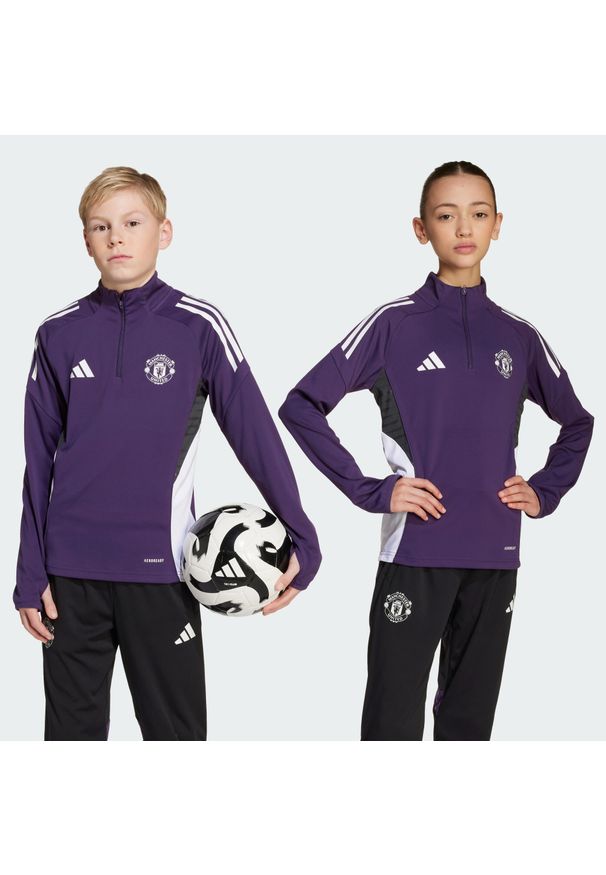 Adidas - Bluza Manchester United Tiro 25 Competition Training Kids. Kolor: fioletowy, biały, wielokolorowy, czarny. Materiał: dresówka. Sport: piłka nożna