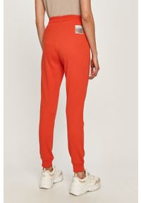 Armani Exchange - Spodnie. Kolor: czerwony. Materiał: bawełna, materiał, dzianina, elastan. Wzór: gładki #3
