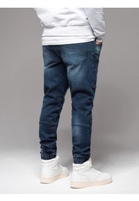 Ombre Clothing - Męskie spodnie jeansowe joggery z przetarciami i zamkami – ciemnoniebieskie V1 - Rozmiar: S. Kolor: niebieski. Materiał: jeans. Styl: retro, klasyczny, rockowy