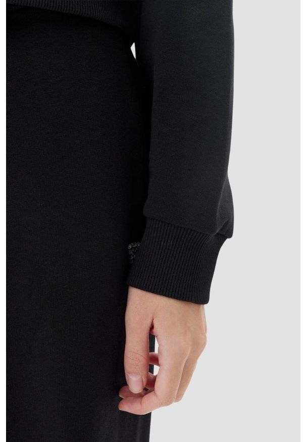Guess - GUESS Сzarna bluza damska z cyrkoniami Primula, Rozmiar L. Kolor: czarny