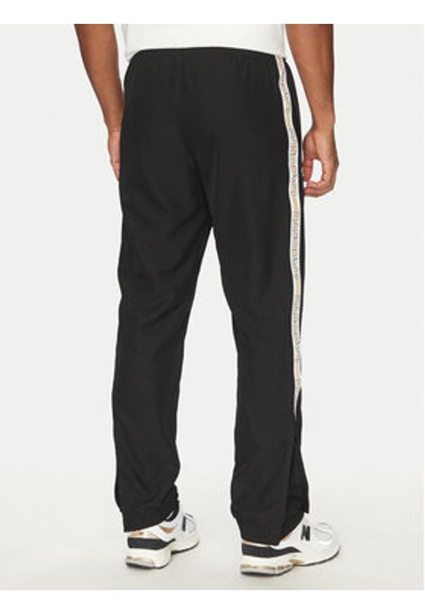 Lacoste Spodnie dresowe XH8974 Czarny Relaxed Fit. Kolor: czarny. Materiał: syntetyk