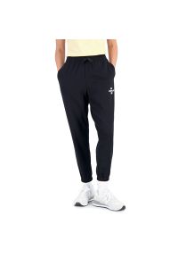 Spodnie New Balance WP31508BK - czarne. Kolor: czarny. Materiał: bawełna, dresówka, poliester #1