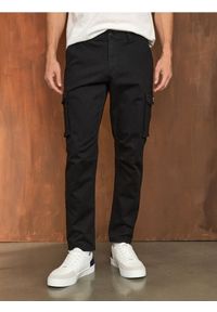 Sinsay - Spodnie cargo - czarny. Kolor: czarny