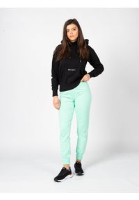Champion Spodnie | 114898 | Kobieta | Zielony. Okazja: na co dzień. Stan: podwyższony. Kolor: zielony. Materiał: bawełna, elastan. Wzór: nadruk. Styl: sportowy, elegancki, casual