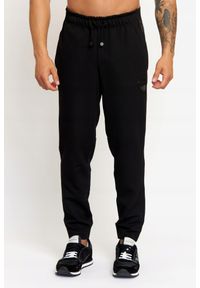 EA7 Emporio Armani - EA7 Męskie spodnie dresowe z lampasami, Rozmiar XL. Kolor: czarny. Materiał: dresówka, poliester. Wzór: aplikacja #1