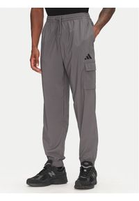 Adidas - adidas Spodnie dresowe Essentials Small Logo JD1822 Szary Regular Fit. Kolor: szary. Materiał: syntetyk