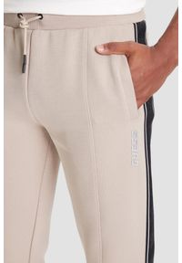 Guess - GUESS Beżowe spodnie męskie z lampasami Mickey, Rozmiar M. Kolor: beżowy #3