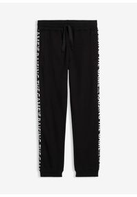 bonprix - Spodnie dresowe z czystej bawełny organicznej. Kolor: czarny. Materiał: dresówka, bawełna. Wzór: napisy