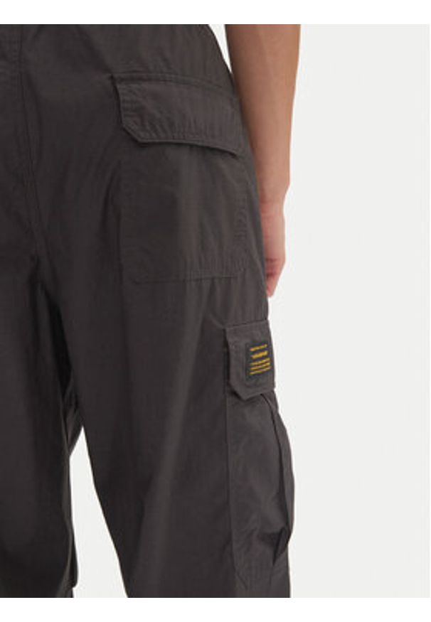 Champion Spodnie dresowe 220414 Czarny Loose Fit. Kolor: czarny. Materiał: bawełna