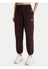 Calvin Klein Jeans Spodnie dresowe Monologo LV047B235G Brązowy Regular Fit. Kolor: brązowy. Materiał: bawełna #1