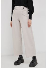JDY Spodnie damskie kolor beżowy szerokie high waist. Stan: podwyższony. Kolor: beżowy. Materiał: tkanina