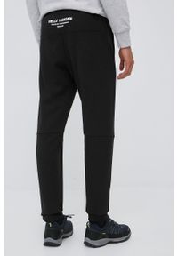 Helly Hansen spodnie dresowe męskie kolor czarny z nadrukiem. Kolor: czarny. Materiał: dresówka. Wzór: nadruk #2