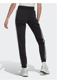 Adidas - adidas Spodnie dresowe Adicolor Classics Slim Cuffed Joggers IB7455 Czarny Slim Fit. Kolor: czarny. Materiał: bawełna