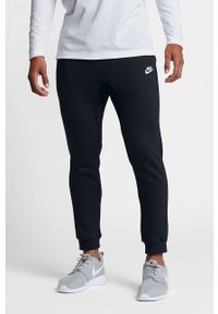 Nike - Spodnie. Kolor: czarny. Materiał: bawełna, poliester, dzianina. Wzór: gładki #1