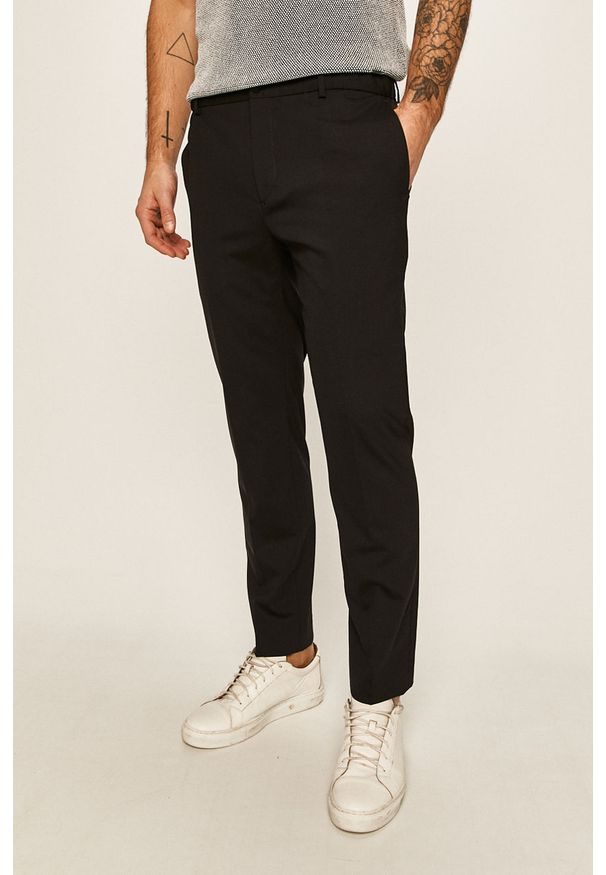 Calvin Klein - Spodnie. Kolor: czarny. Materiał: wełna, bawełna, materiał, elastan, tkanina, poliester. Wzór: gładki