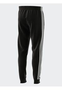 Adidas - adidas Spodnie dresowe IB3999 Czarny Slim Fit. Kolor: czarny. Materiał: bawełna #7