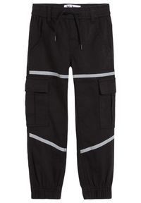 bonprix - Spodnie bojówki chłopięce z odblaskowymi elementami, Tapered Fit. Kolor: czarny #1