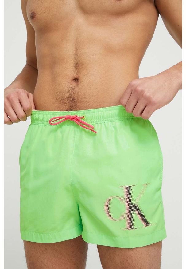 Calvin Klein szorty kąpielowe kolor zielony. Kolor: zielony. Materiał: tkanina, poliester, materiał. Wzór: nadruk