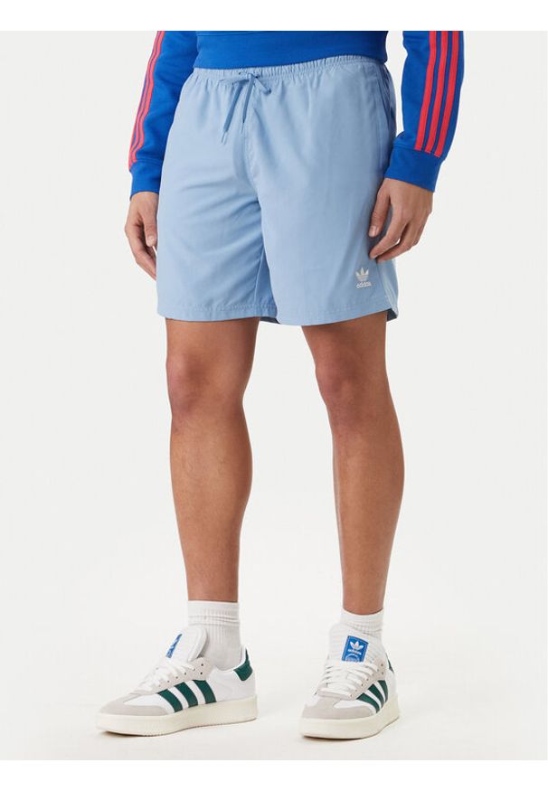 Adidas - adidas Szorty kąpielowe adicolor 3-Stripes JX5017 Błękitny Regular Fit. Kolor: niebieski. Materiał: syntetyk