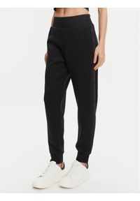 Guess Spodnie dresowe W5YB11 KBYE2 Czarny Regular Fit. Kolor: czarny. Materiał: wiskoza, syntetyk #1