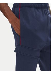 Nike Spodnie dresowe HM0180 Granatowy Regular Fit. Kolor: niebieski. Materiał: bawełna