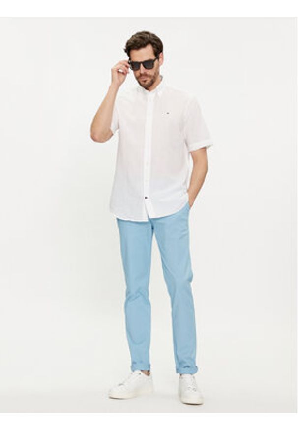 TOMMY HILFIGER - Tommy Hilfiger Chinosy Bleecker MW0MW26619 Błękitny Slim Fit. Kolor: niebieski. Materiał: bawełna