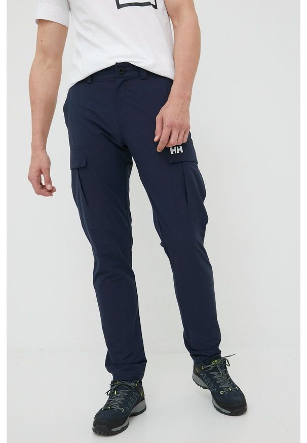 Helly Hansen spodnie outdoorowe męskie kolor granatowy. Kolor: niebieski. Materiał: tkanina, materiał