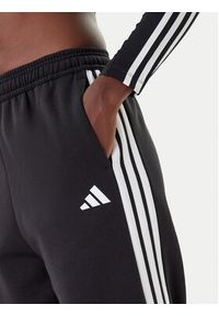 Adidas - adidas Spodnie dresowe Tiro 3-Stripes JL7488 Czarny Loose Fit. Kolor: czarny. Materiał: syntetyk #5