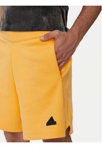 Adidas - adidas Szorty sportowe Z.N.E. Premium IR5235 Pomarańczowy Loose Fit. Kolor: pomarańczowy. Materiał: bawełna. Styl: sportowy
