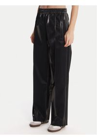 Adidas - adidas Spodnie dresowe adicolor Holiday JV7503 Czarny Loose Fit. Kolor: czarny. Materiał: wiskoza #1