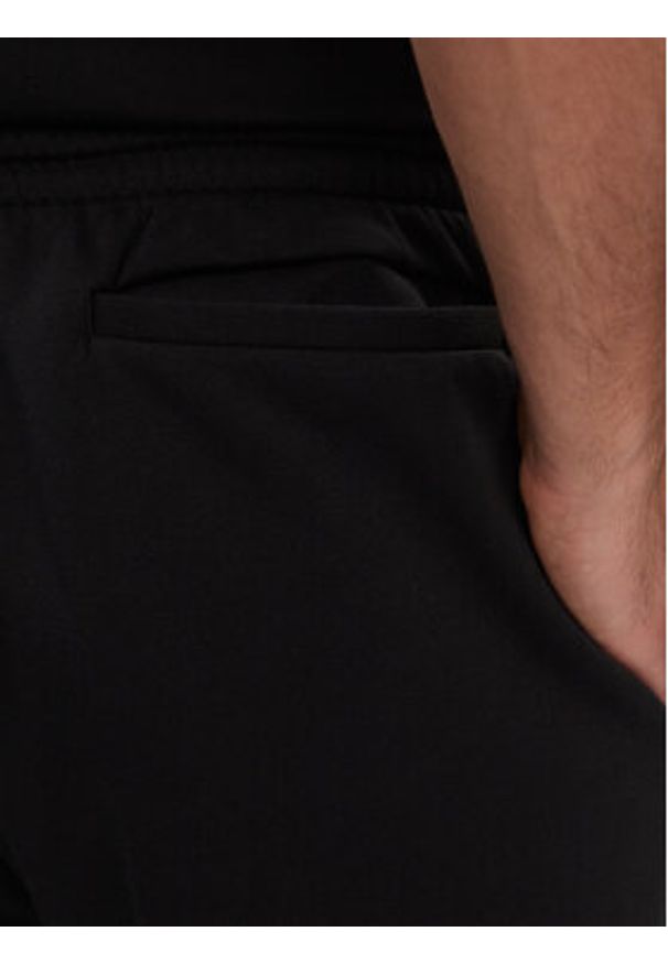Adidas - adidas Spodnie dresowe Essentials Fleece Regular Tapered Joggers HL2236 Czarny Regular Fit. Kolor: czarny. Materiał: bawełna