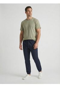 Sinsay - Bawełniane spodnie jogger - granatowy. Kolor: niebieski. Materiał: bawełna