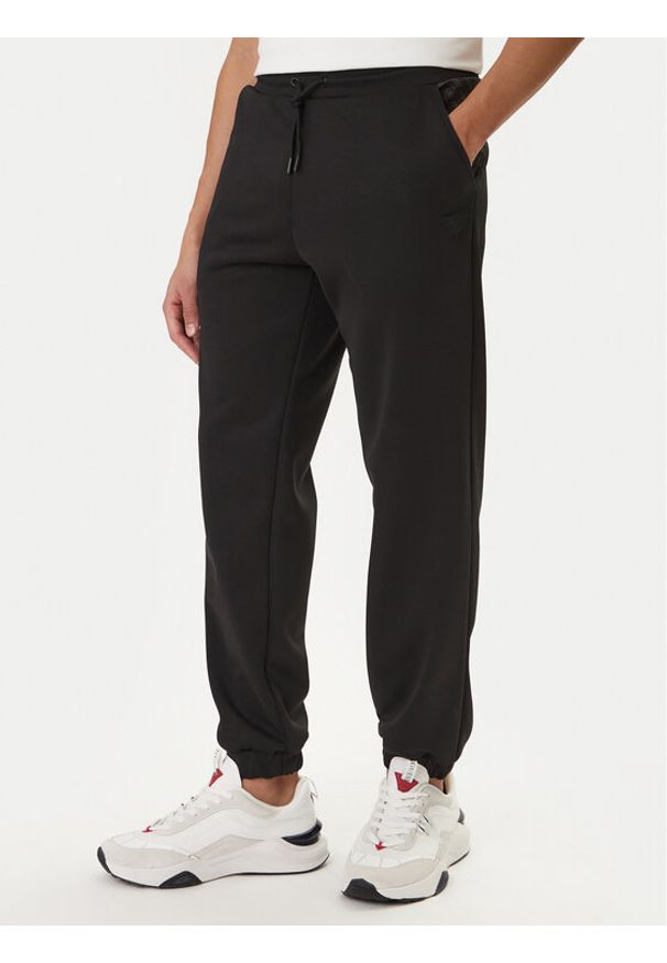 Guess Spodnie dresowe Z6RB09 KD472 Czarny Regular Fit. Kolor: czarny. Materiał: syntetyk