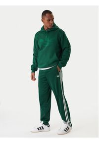 Adidas - adidas Spodnie dresowe Firebird KD8317 Zielony Loose Fit. Kolor: zielony. Materiał: syntetyk #2