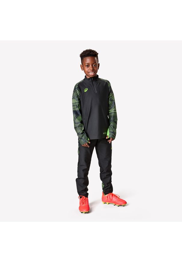 KIPSTA - Spodnie piłkarskie dla dzieci Kipsta Viralto Wavy. Kolor: żółty, czarny, wielokolorowy, zielony. Materiał: poliester, materiał, elastan. Sport: piłka nożna