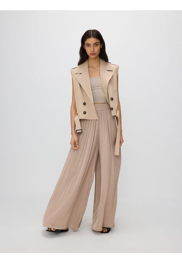 Reserved - Spodnie palazzo - beżowy. Kolor: beżowy. Materiał: tkanina. Wzór: gładki