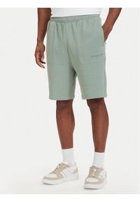 TOMMY HILFIGER - Tommy Hilfiger Szorty sportowe Essential UM0UM03914 Zielony jasny Regular Fit. Kolor: zielony. Materiał: bawełna. Styl: sportowy #1