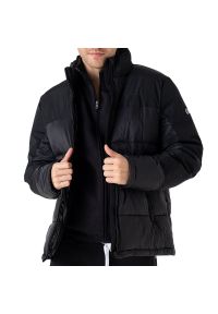 Kurtka Champion C Logo Full-Zip Padded 219191-KK001 - czarna. Typ kołnierza: kaptur. Kolor: czarny. Materiał: nylon. Styl: klasyczny, elegancki
