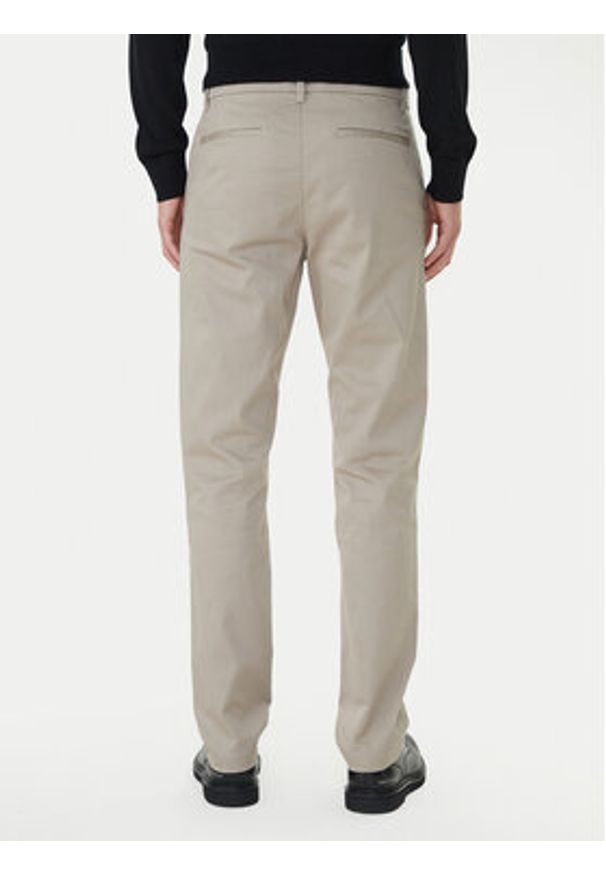 Calvin Klein Chinosy LV040EM633 Beżowy Slim Fit. Kolor: beżowy. Materiał: bawełna