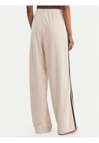 Adidas - adidas Spodnie dresowe Terry Towel Firebird KQ6661 Beżowy Loose Fit. Kolor: beżowy. Materiał: bawełna #4