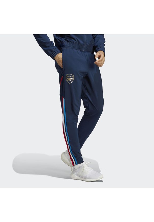 Spodnie do piłki nożnej męskie Adidas Arsenal Presentation Pants. Kolor: niebieski. Materiał: materiał, dresówka