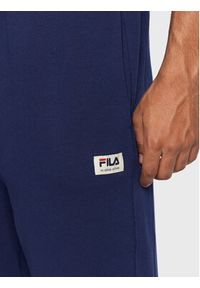 Fila Spodnie dresowe Tricase FAM0153 Granatowy Oversize. Kolor: niebieski. Materiał: bawełna, syntetyk #4