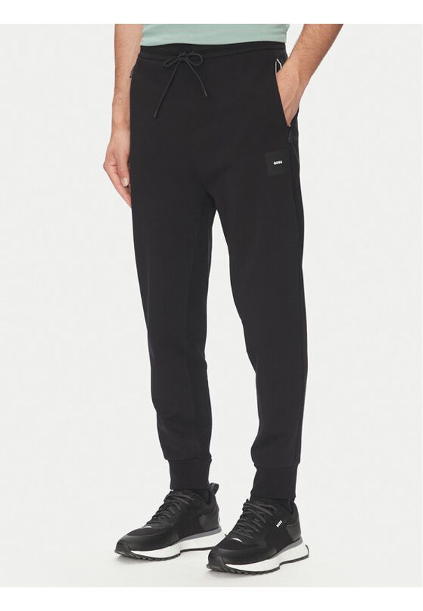 BOSS Spodnie dresowe Hadiko 50537198 Czarny Regular Fit. Kolor: czarny. Materiał: bawełna