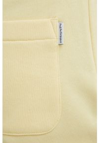 Peak Performance spodnie dresowe damskie kolor żółty gładkie. Kolor: żółty. Materiał: dresówka. Wzór: gładki #2